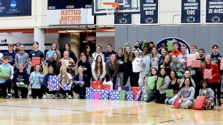 Penn State Abington student athletes wrapped gift for a family in need